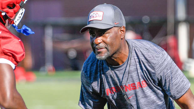 Razorbacks' defensive secondary coach Marcus Woodson on the outdoor turf field Wednesday morning